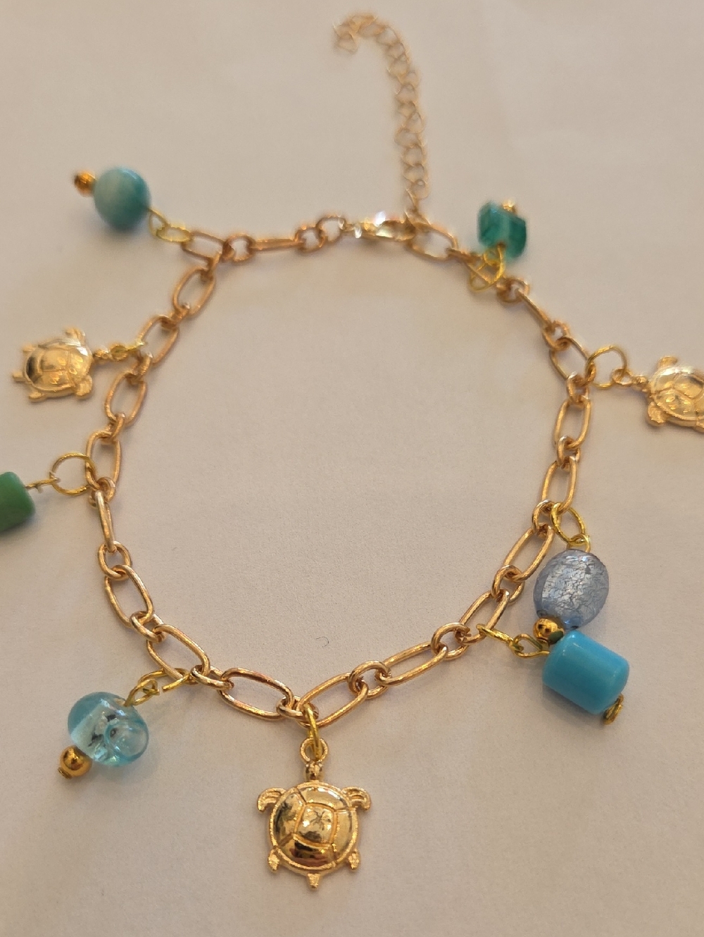 Gold-Tone Turtle Charm Bracelet with Turquoise Beads